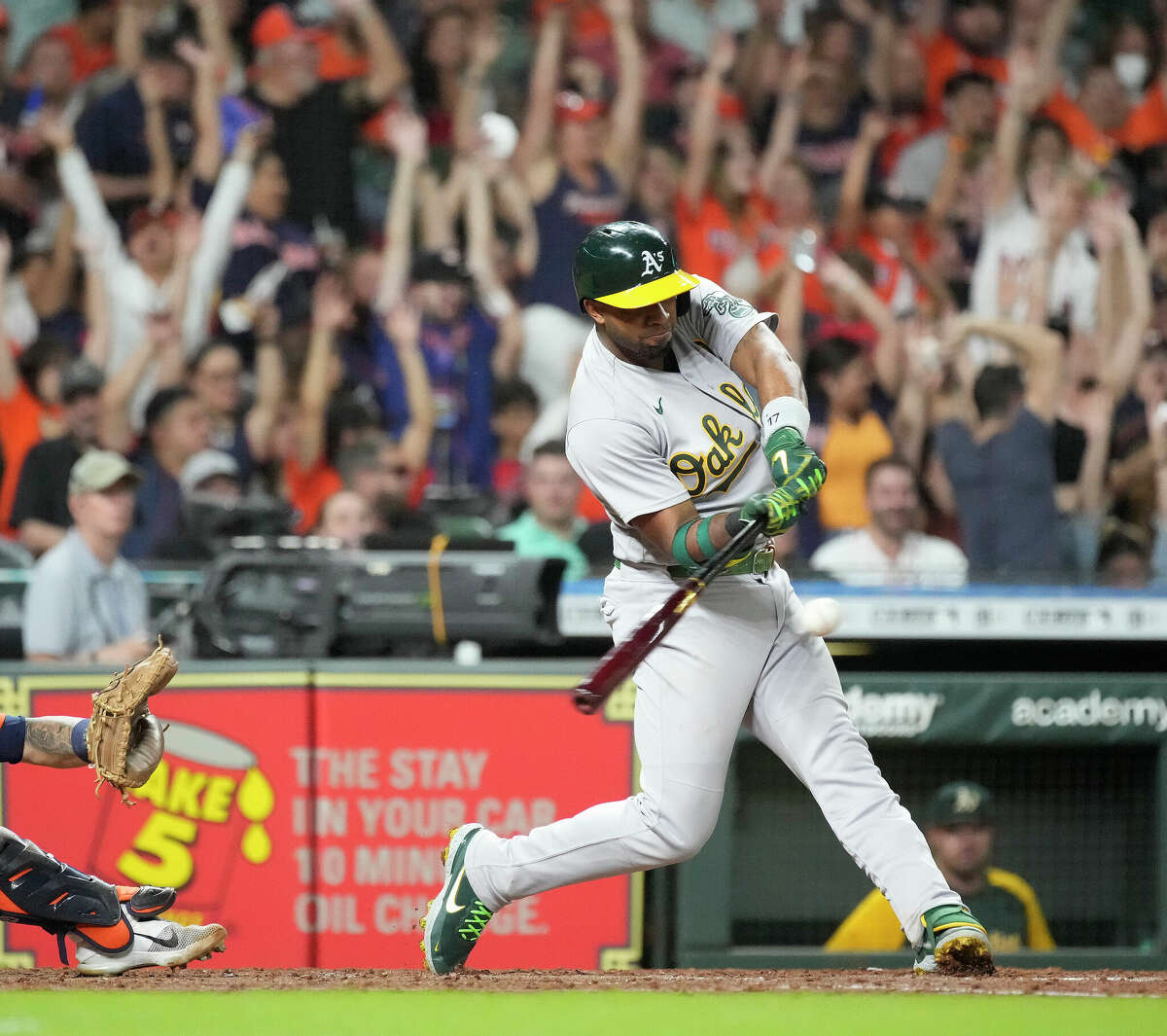 Oakland Athletics Elvis Andrus (17) drives in two runs off of Houston Astros starting pitcher Jose Urquidy (65) during the seventh inning of a MLB baseball game at Minute Maid Park on Friday, July 15, 2022 in Houston.