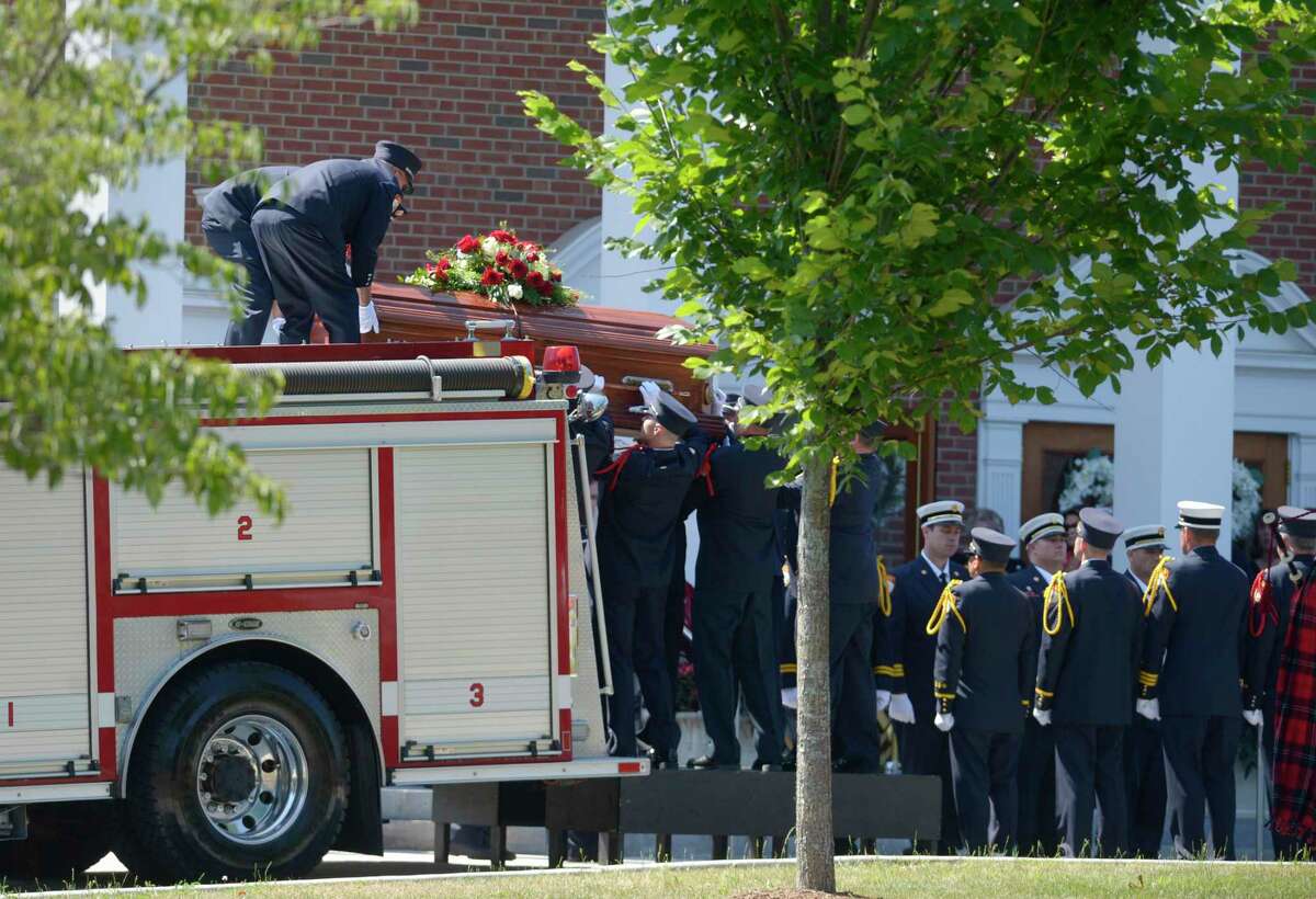 Community members gathered to mourn the death of William Halstead, longtime chief of the Sandy Hook Volunteer Fire & Rescue.