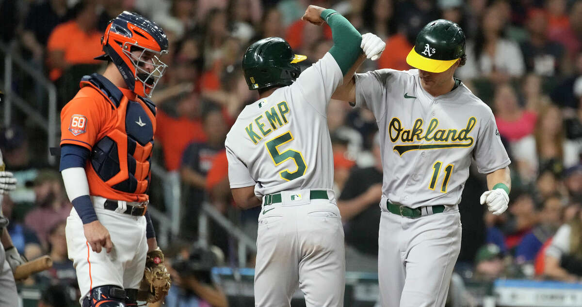Oakland Athletics Skye Bolt and Tony Kemp celebrate his two- run home run off of Houston Astros relief pitcher Seth Martinez during the ninth inning of a MLB baseball game at Minute Maid Park on Friday, July 15, 2022 in Houston.