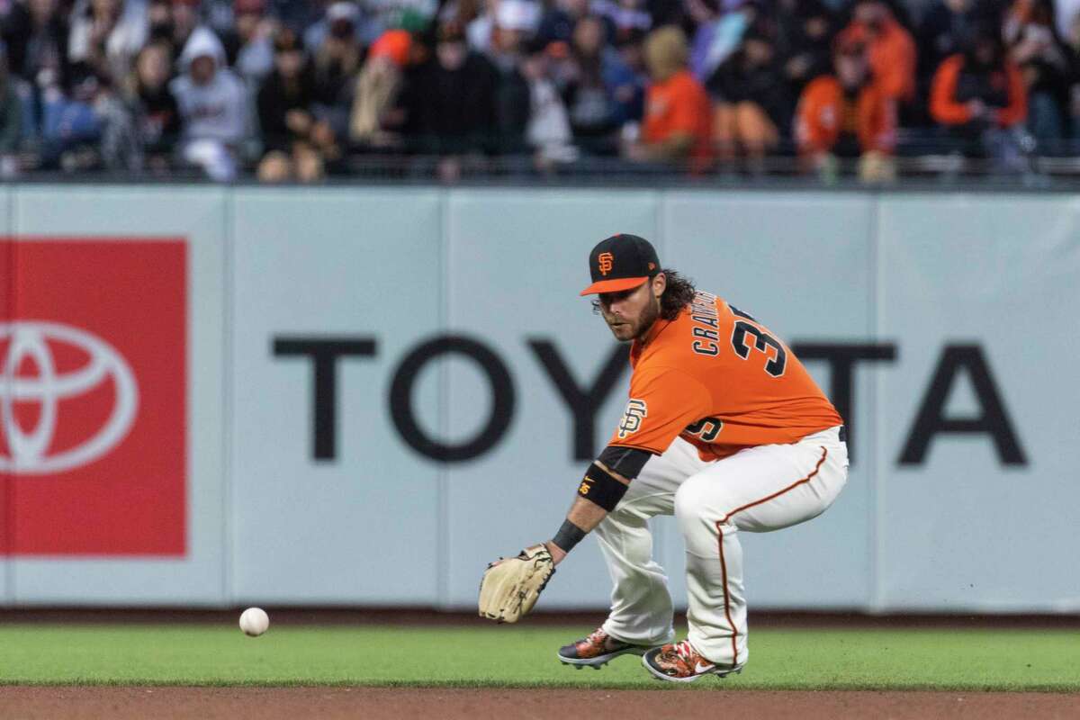 San Francisco Giants' Brandon Crawford fields a ball hit by Milwaukee Brewers’ Mike Brosseau during the fourth inning of a MLB baseball game in San Francisco, Calif. Friday, July 15, 2022.