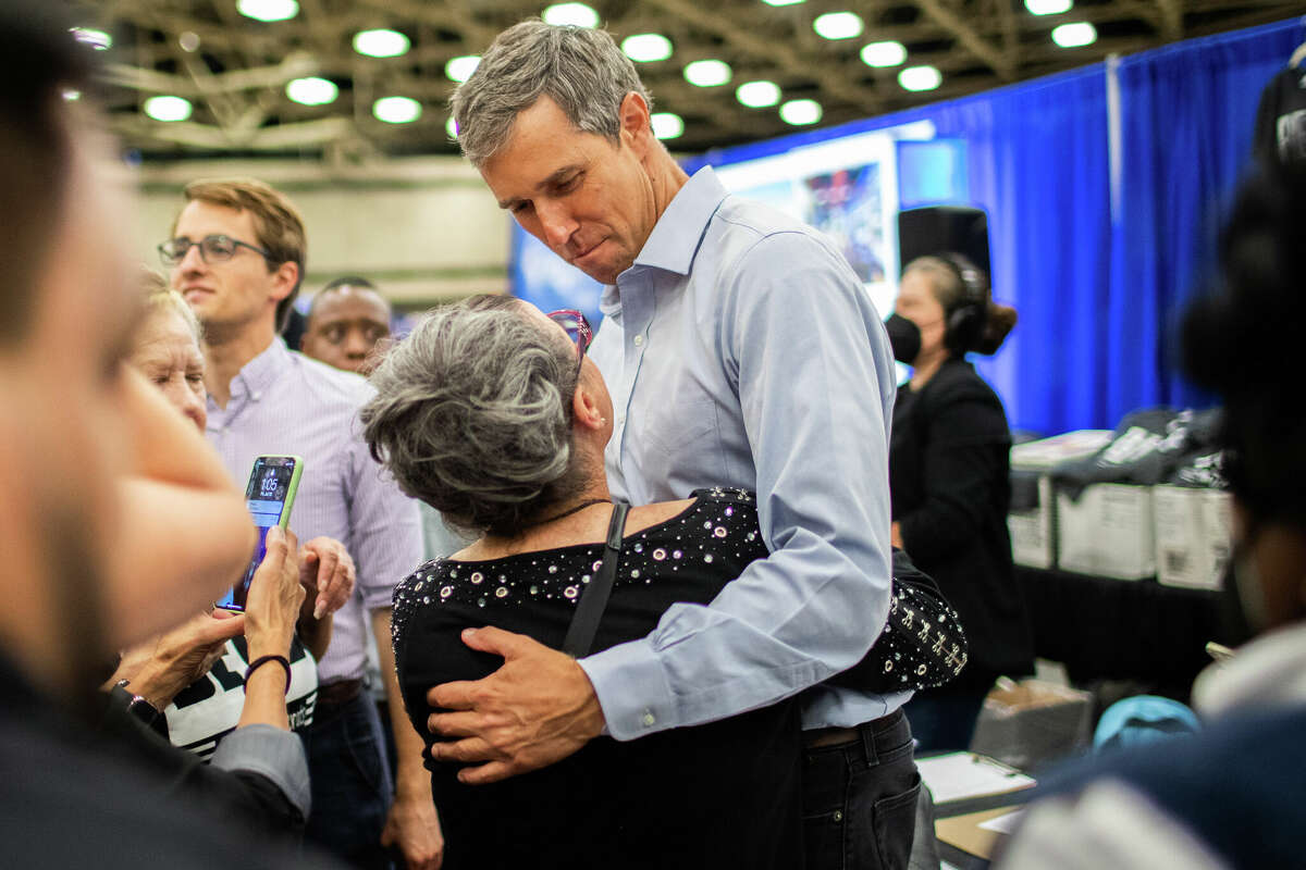 Texas governor candidate Beto O'Rourke holds a supporter as she talks to him at the 2022 Texas Democratic Convention, Friday, July 15, 2022, in Dallas.