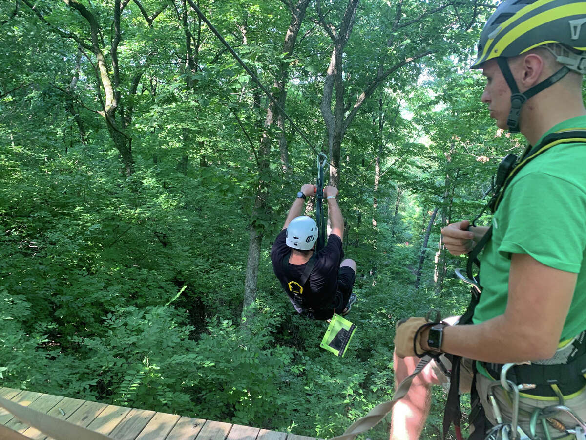 Tim Wisniewski rides one of the eight Grafton Zipeline tours at Aerie's Resort. The park offers two miles of adventure.