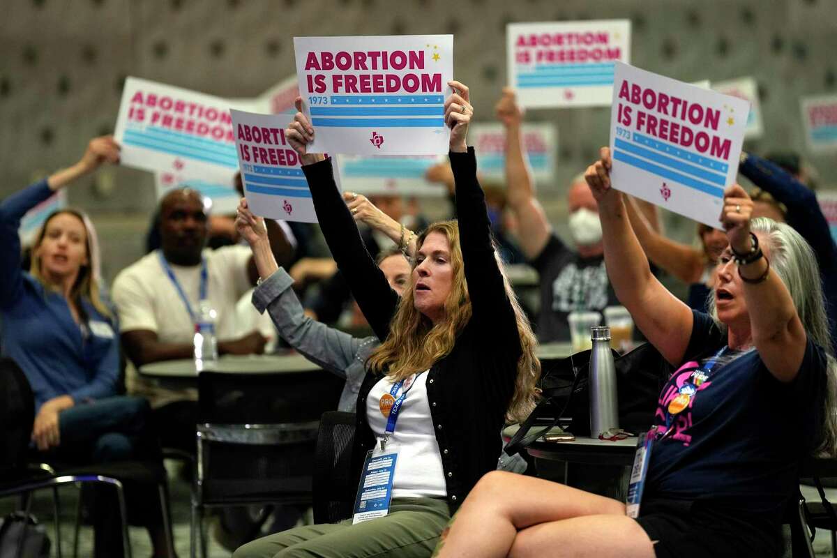 People in favor of the right to an abortion participate in the “Pro-Choice Caucus” meeting during the 2022 Texas Democratic Convention, Friday, July 15, 2022, in Dallas.