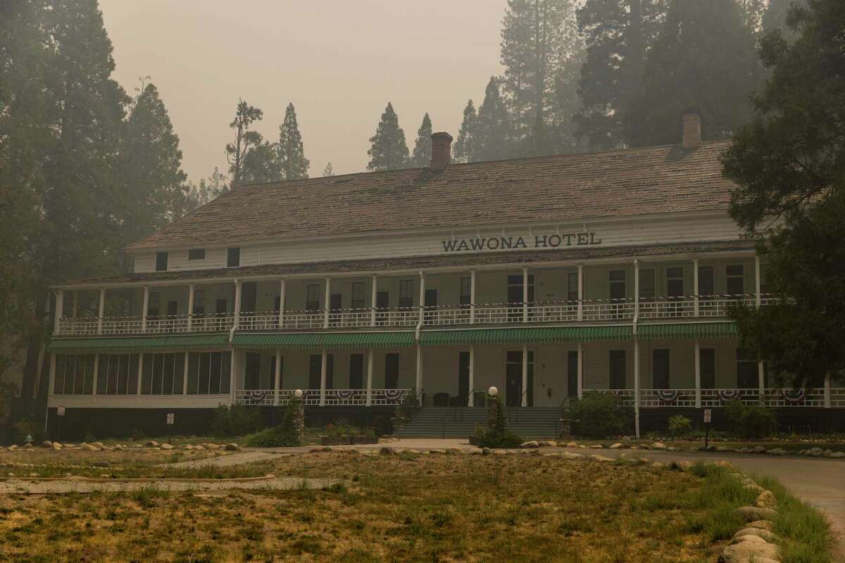 The Wawona Hotel, undamaged from the Washburn Fire, is seen under a smoke-filled sky in Yosemite National Park on July 11, 2022.