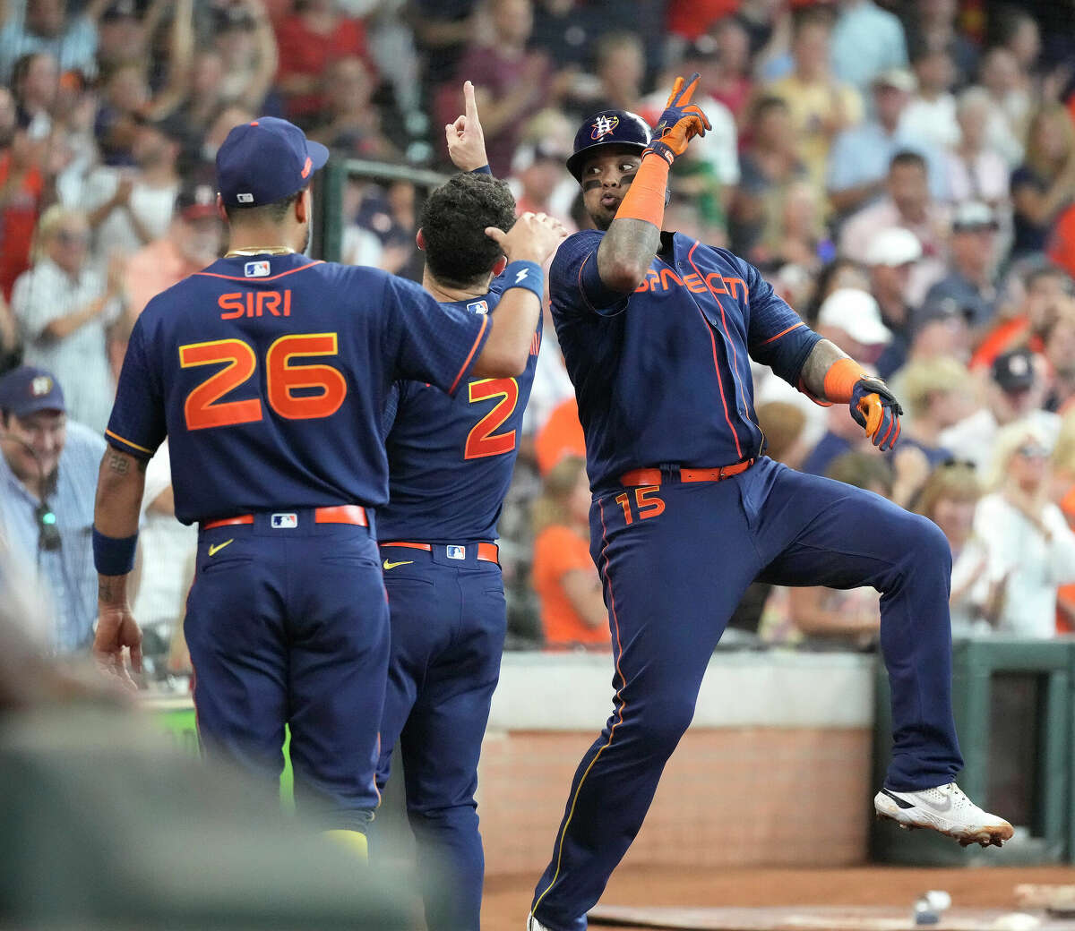 Houston Astros' Martin Maldonado (15) celebrates with Alex Bregman (2) and Jose Siri (26) after hitting a grand slam off of Oakland Athletics starting pitcher Jared Koenig (46) during the second inning of a MLB baseball game at Minute Maid Park on Saturday, July 16, 2022 in Houston.