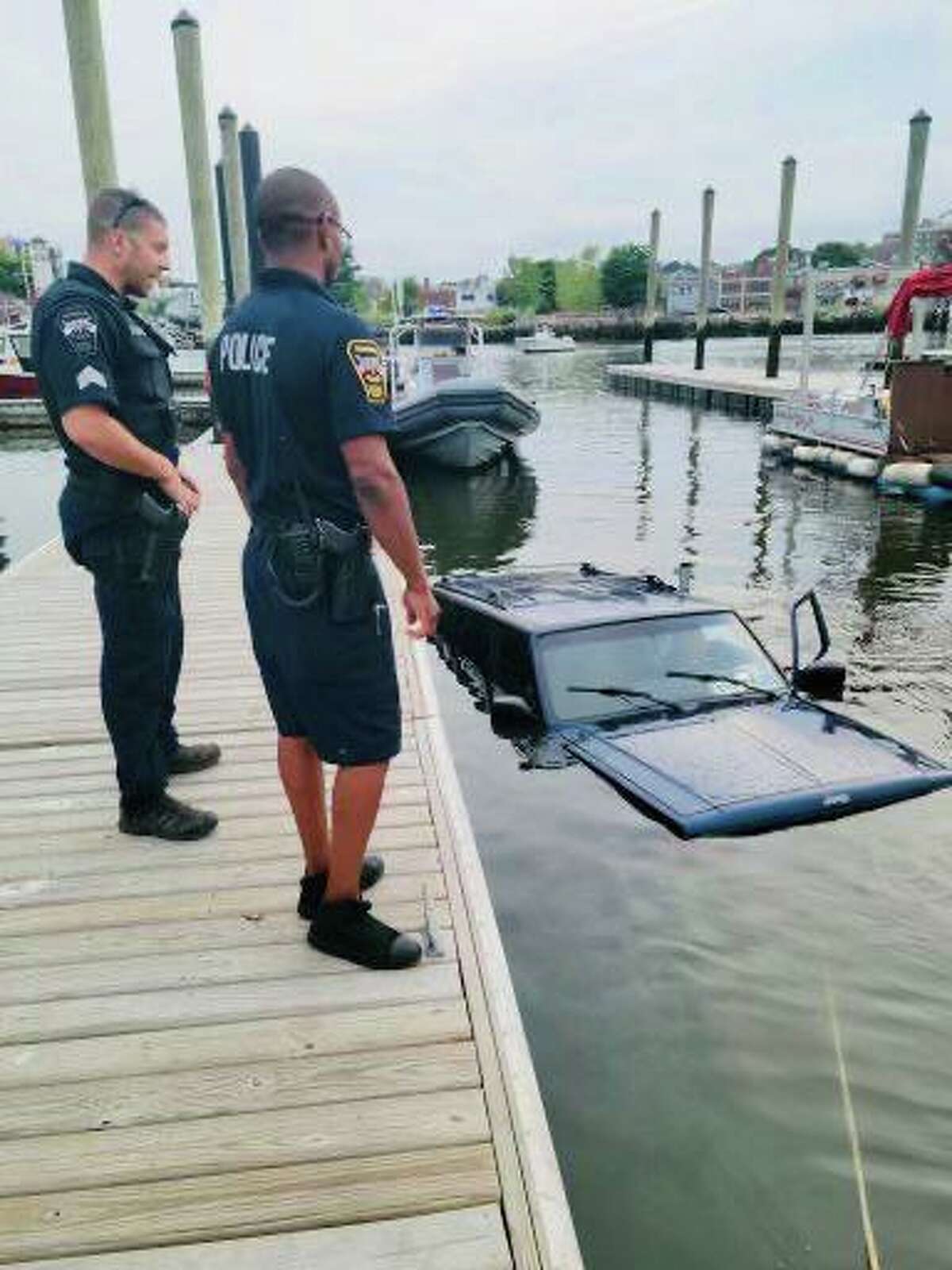 Police said this vehicle and its trailer were both removed from the water near the Veteran’s Park boat launch after both went into the water. No injuries were reported.