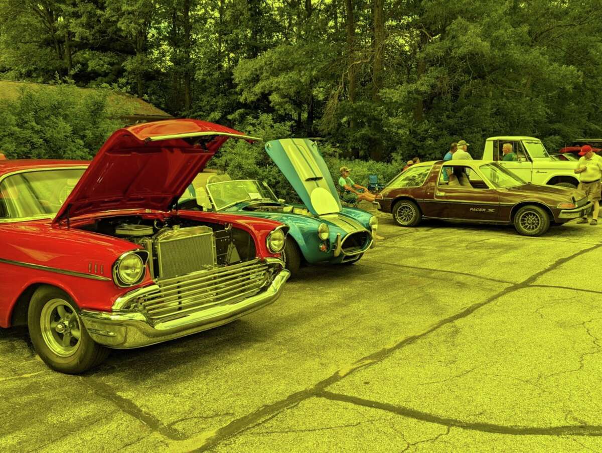 People gather to view vintage cars during Midland's Berryhill American