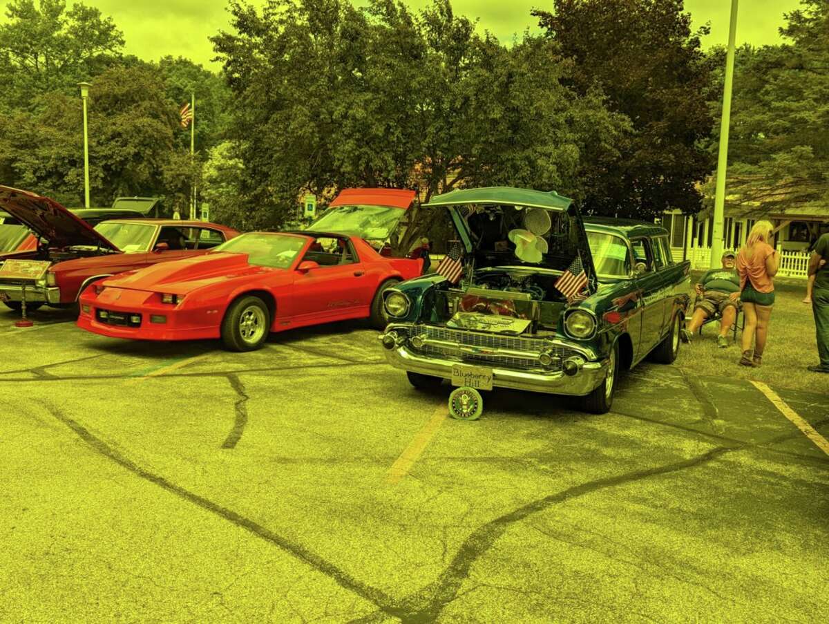 People gather to view vintage cars during Midland's Berryhill American