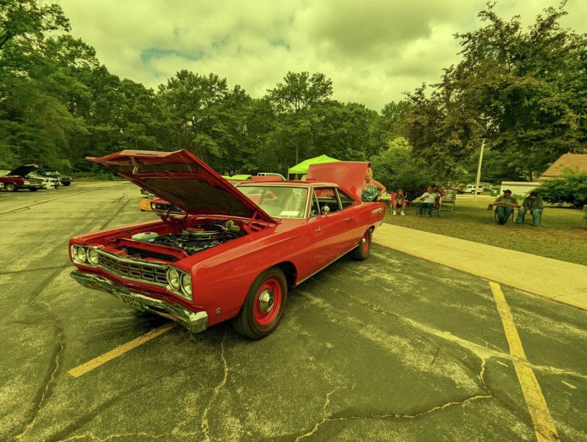 People gather to view vintage cars during Midland's Berryhill American