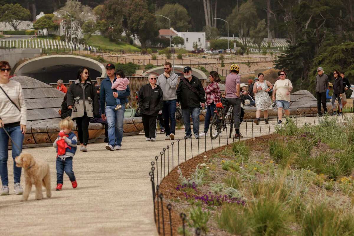 Visitors explore the meandering paths of the Presidio’s new Tunnel Tops park in San Francisco on Sunday. After years of planning and delays, the park is now open to the public.