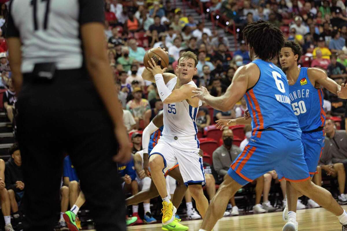 Warriors guard Mac McClung (55) looks for an open pass during Friday night’s game against the Thunder. McClung had 14 points and six assists in Sunday’s summer league finale.