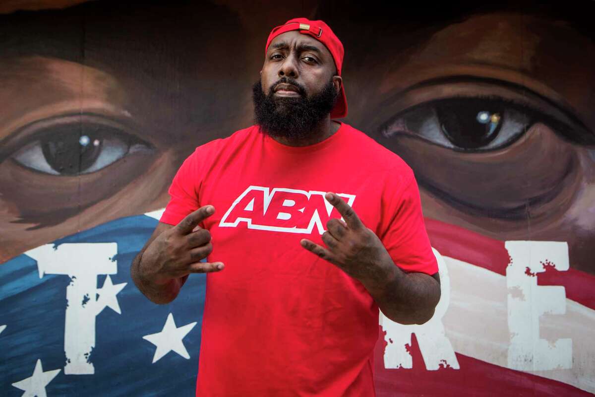 Rap artist and community activist Trae Tha Truth poses for a portrait Wednesday, Dec. 23, 2020 in Houston. Trae has made it a mission to give back to the community over the years. In 2020, he and his Relief Gang have rose to the occasion in such a tumultuous year. He and the Relief gang has given face masks to inmates in the Harris County Jail, masks and PPE, food, toys and gift cards to support to people in the community. He also led his team to East Texas and Louisiana after two devastating hurricanes ravaged the area. He also was a leader protesting social injustice following the death of George Floyd, as one of the people organizing the protest march through Houston. He also spearheaded efforts to bring the "Say Their Names" traveling memorial to Emancipation Park in Houston.