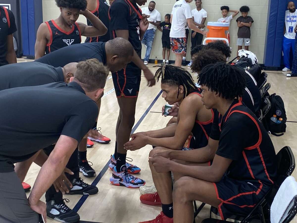 UConn commit Solomon Ball listens to his Team Melo coaches during a timeout Monday at the Peach Jam.