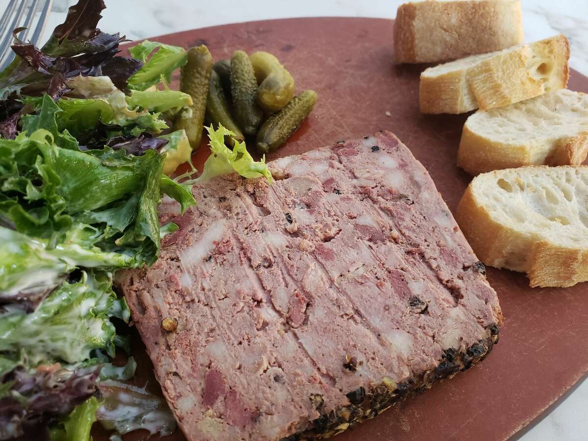 Pâté de Campagne accompanied by the de rigueur cornichons and some greens with a mustardy vinaigrette at the Rive Bistro is a standard of French cuisine.