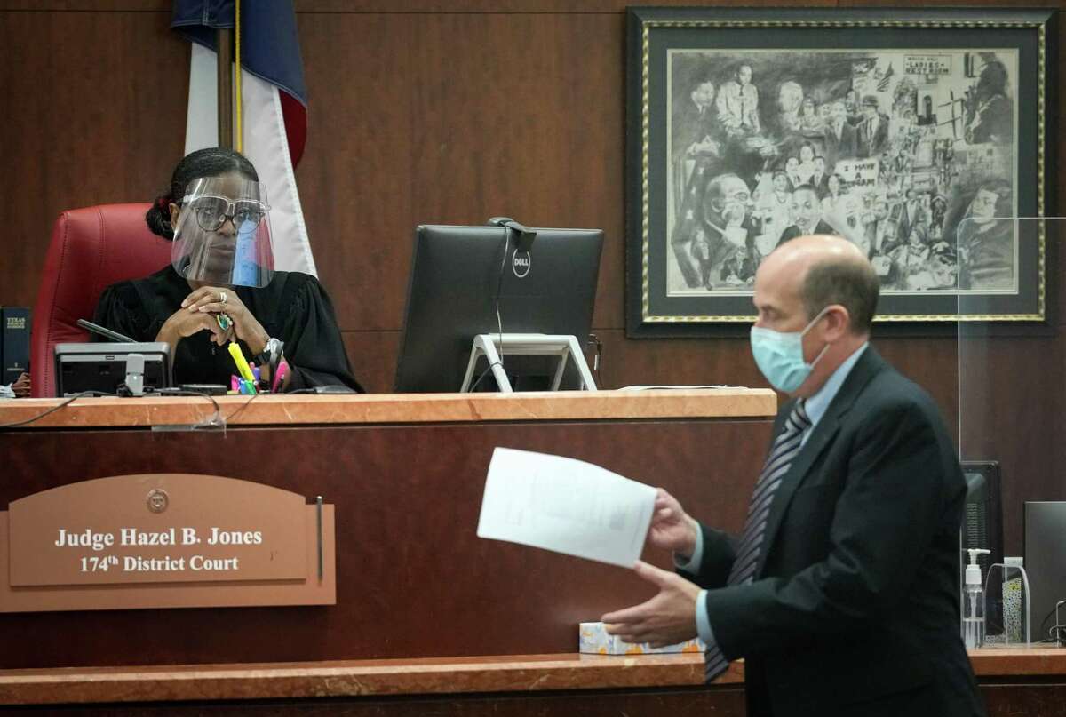 Judge Hazel Jones looks at David Adler, a defense attorney for Wallis Nader, during a hearing about Nader’s bond conditions in the 174th District Court on Monday, July 18, 2022, at the Harris County Criminal Courthouse at 1201 Franklin St. in Houston. Nader and two other Harris County aides are charged with steering a controversial COVID-19 vaccine contract to firm operated by a politically-connected vendor.