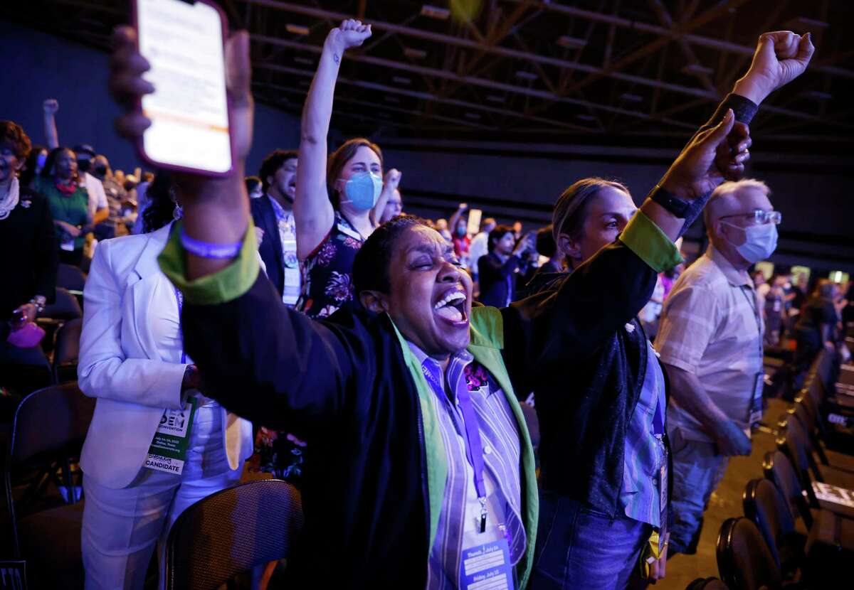 Delegate Hazel Weathers and others cheer U.S. Representative Sheila Jackson Lee of Houston who recognized WNBA basketball player Brittney Griner during the 2022 Texas Democratic Convention at the Kay Bailey Hutchison Convention Center in Dallas, Friday, July 15, 2022. Griner is jailed in Russia. (Tom Fox/The Dallas Morning News via AP)