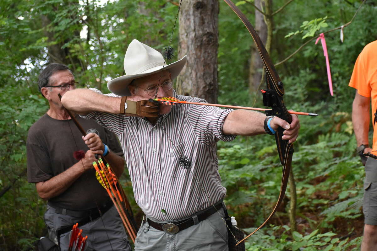 Roger Balis prepares to release a shot at a foam target at the 13th annual stick bow shoot.