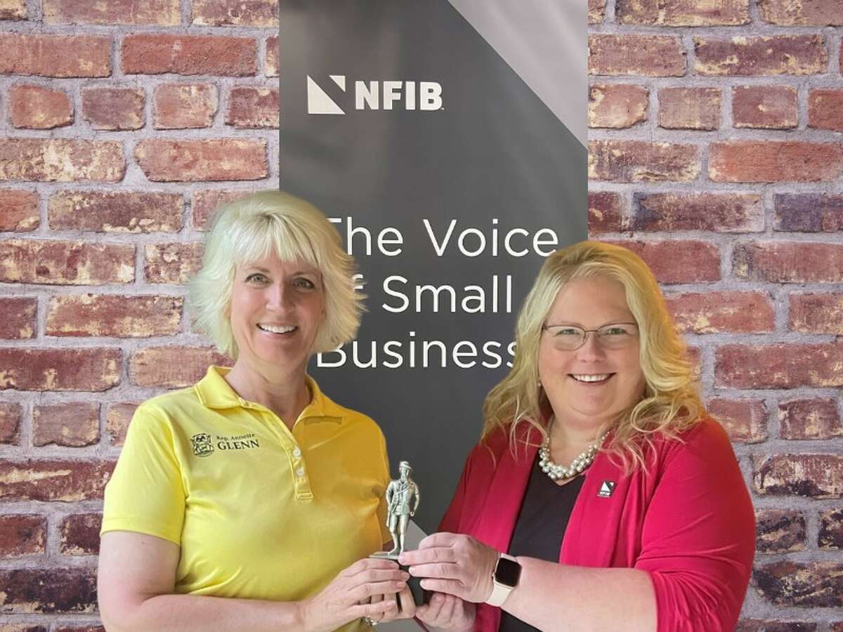 Rep. Annette Glenn (left) is presented with the Guardian of Small Business Award by NFIB Michigan State Director Amanda Fisher.