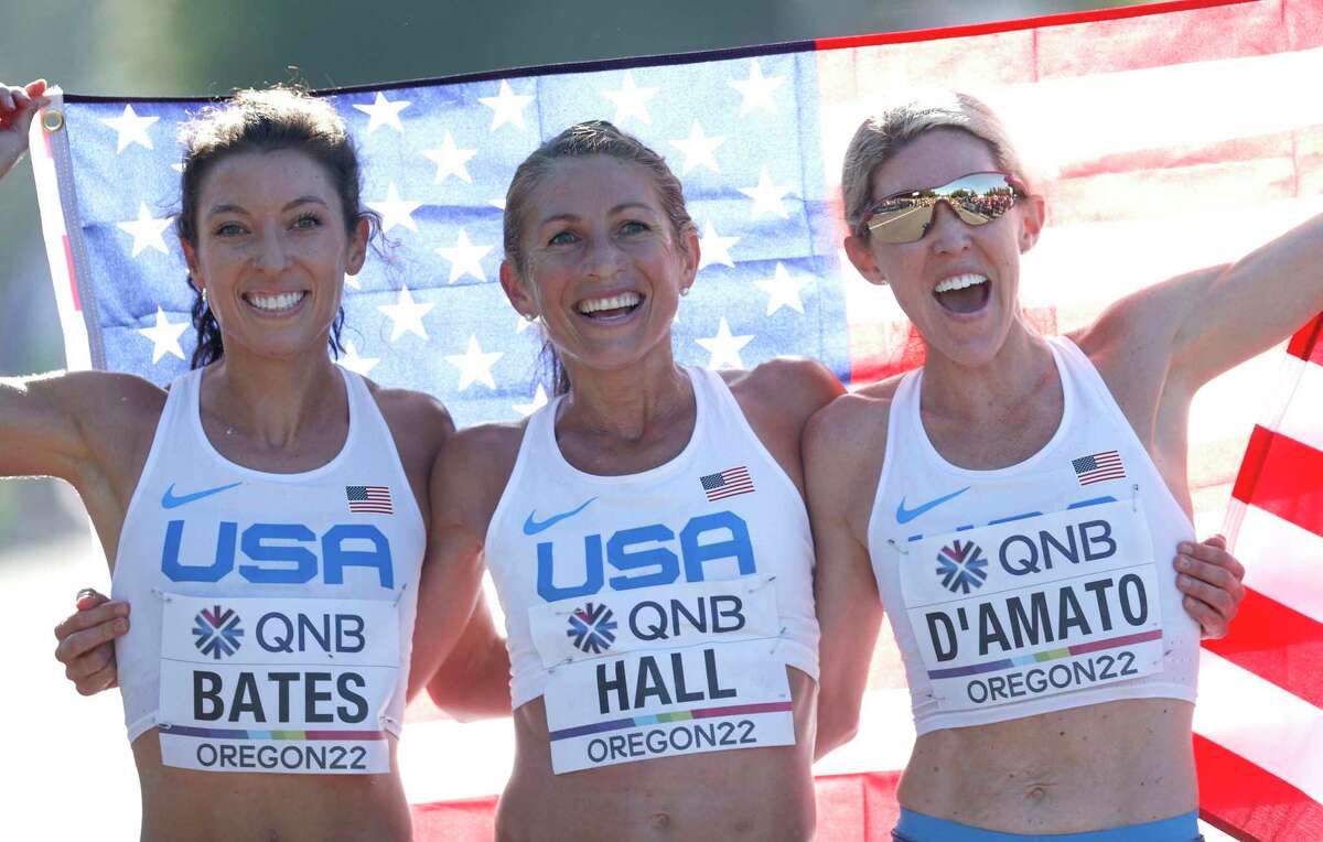 EUGENE, OREGON - JULY 18: Emma Bates, Sarah Hall and Keira D'Amato of Team United States react after competing in the Women's Marathon on day four of the World Athletics Championships Oregon22 at Hayward Field on July 18, 2022 in Eugene, Oregon. (Photo by Steph Chambers/Getty Images)