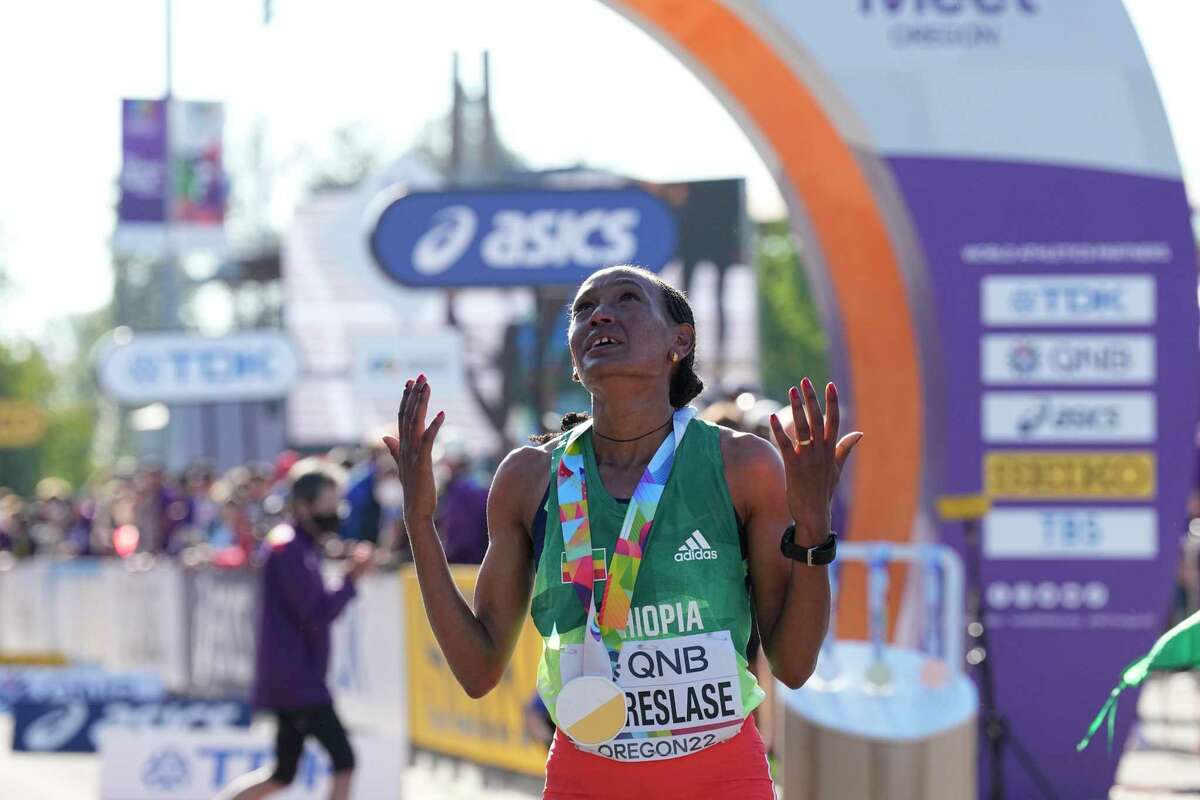 Gotytom Gebreslase, of Ethiopia, celebrates after winning the women's marathon at the World Athletics Championships Monday, July 18, 2022, in Eugene, Ore. (AP Photo/Gregory Bull)