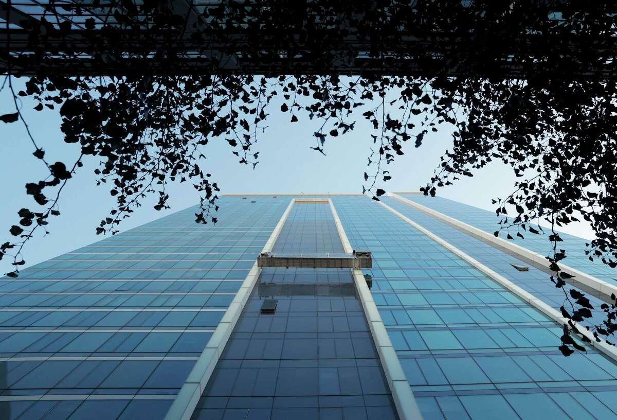 Window washers clean the outside of the residential building 33 Tehama near the Transbay terminal in San Francisco in 2017. In June of this year the building suffered heavy water damage and flooding.