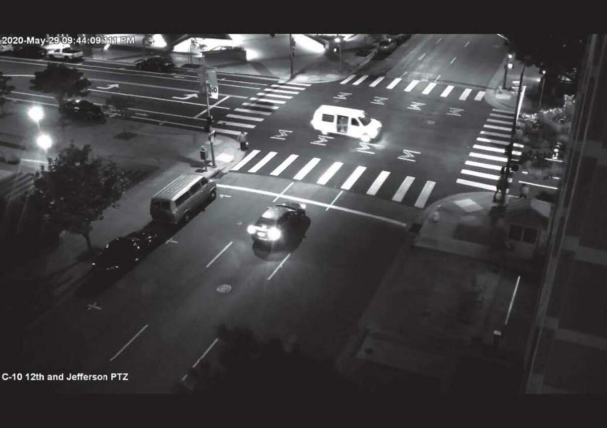 Security footage shows the white van used by Steven Carrillo during the May 2020 killing of David Patrick Underwood, a contract security officer for the Department of Homeland Security.