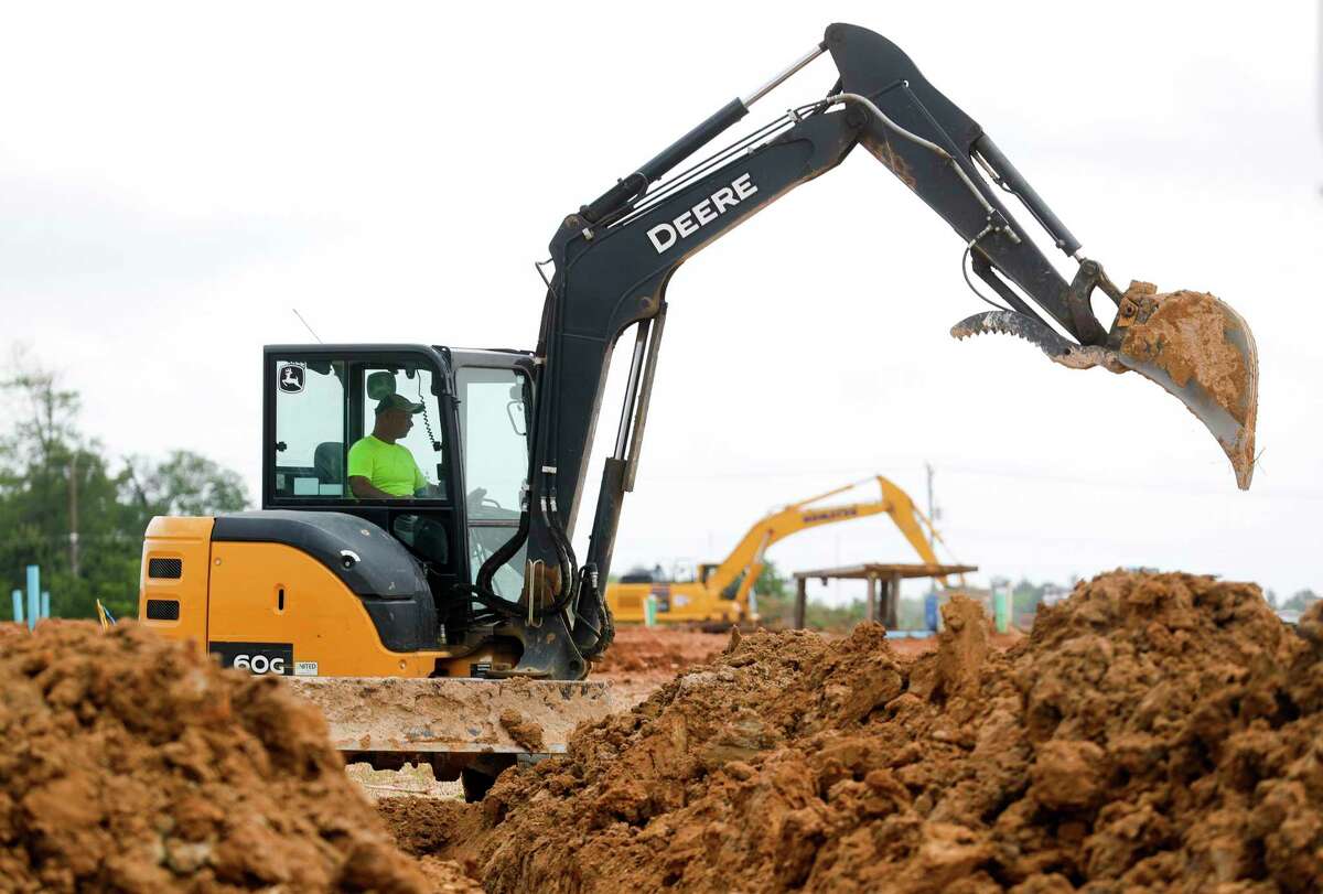 Construction workers continue unity infrastructure work on a new subdivision. After increasing the minimum lot size for new residential development, the Conroe City Council approved the annexation of 98 acres for a new KB Home subdivision that will feature smaller lots.