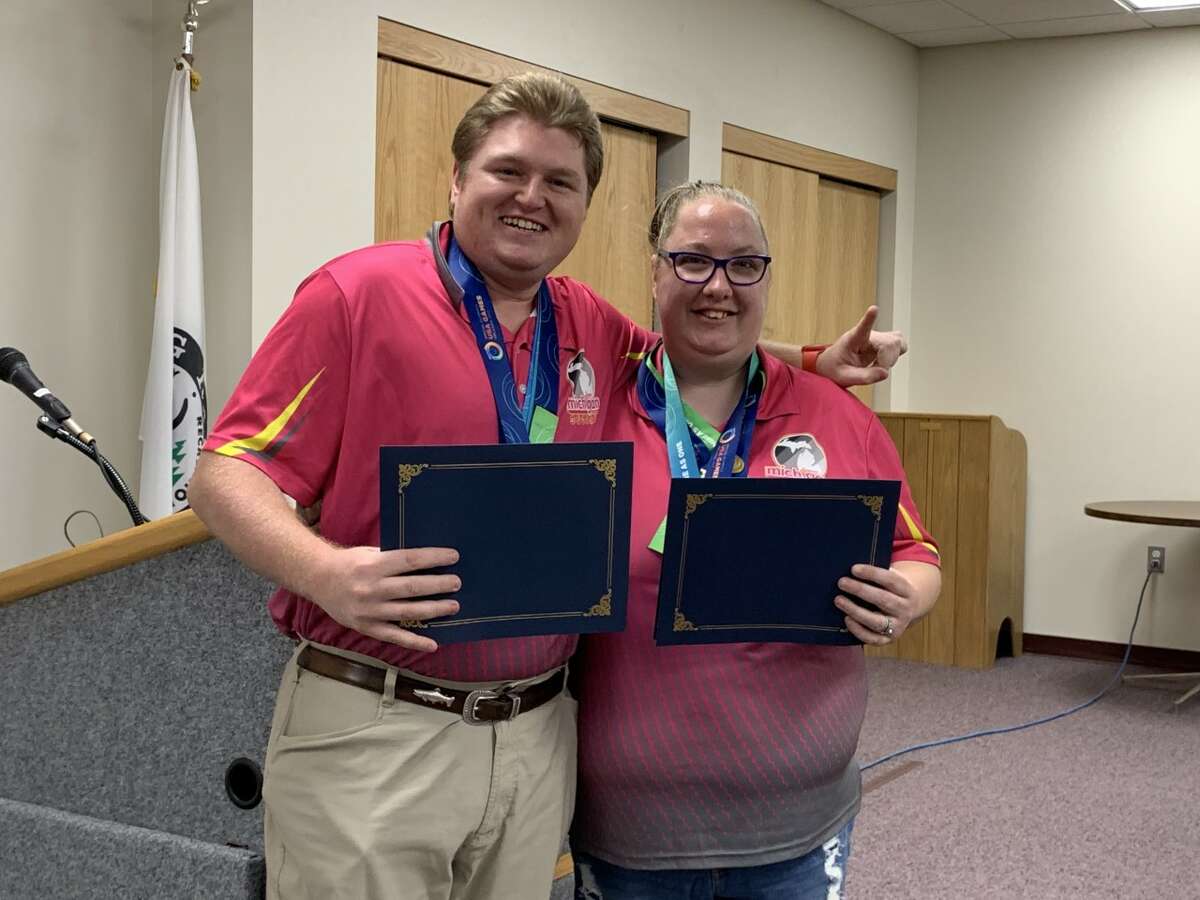 Special Olympics medal winners Amanda Davis (left) and Tyler Lawton (right) were presented with a proclamation of recognition for their achievements during the city commission meeting this week in Big Rapids.