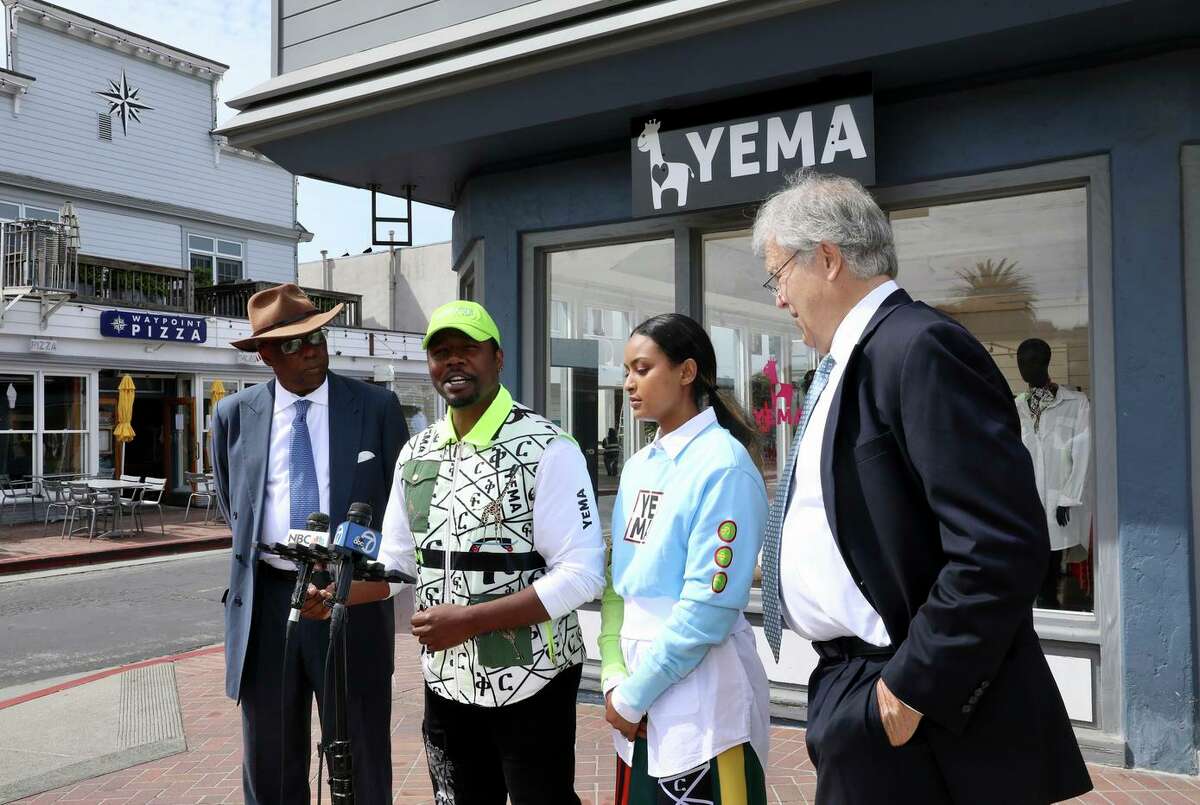 Yema Khalif, second from left, and his wife Hawi Awash, third from left, hold a press conference with their attorneys to announce a series of reforms stemming from a 2020 police encounter at their store, Yema. Police officers from Tiburon and Belvedere confronted the owners while they were working late and demanded proof that they belonged there. The couple, who decided against legal action against the town of Tiburon in favor of restorative justice solutions, is suing Belvedere over the same incident.