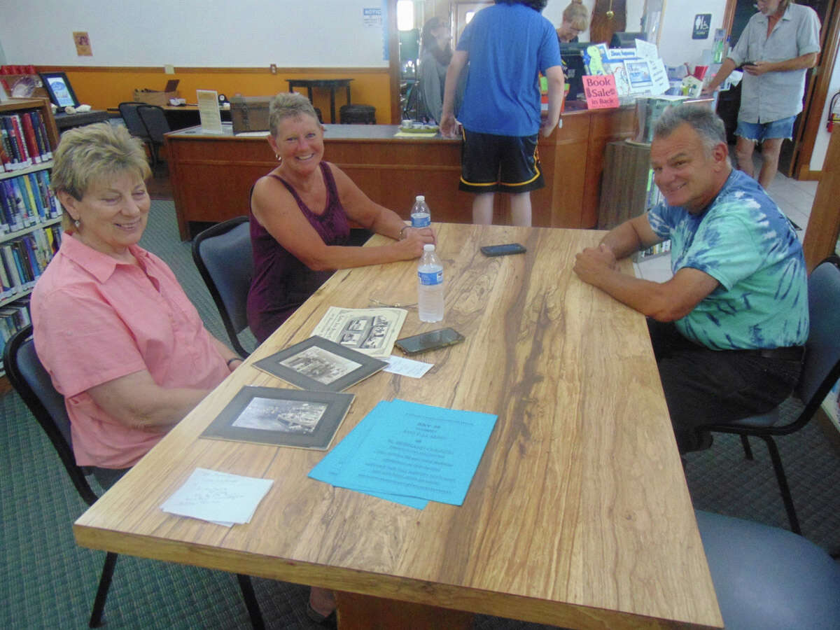 Alicia Campbell and Christina and Christopher Raymond share some of the memories of Luther Grocery and that corner of the west side of downtown Luther.