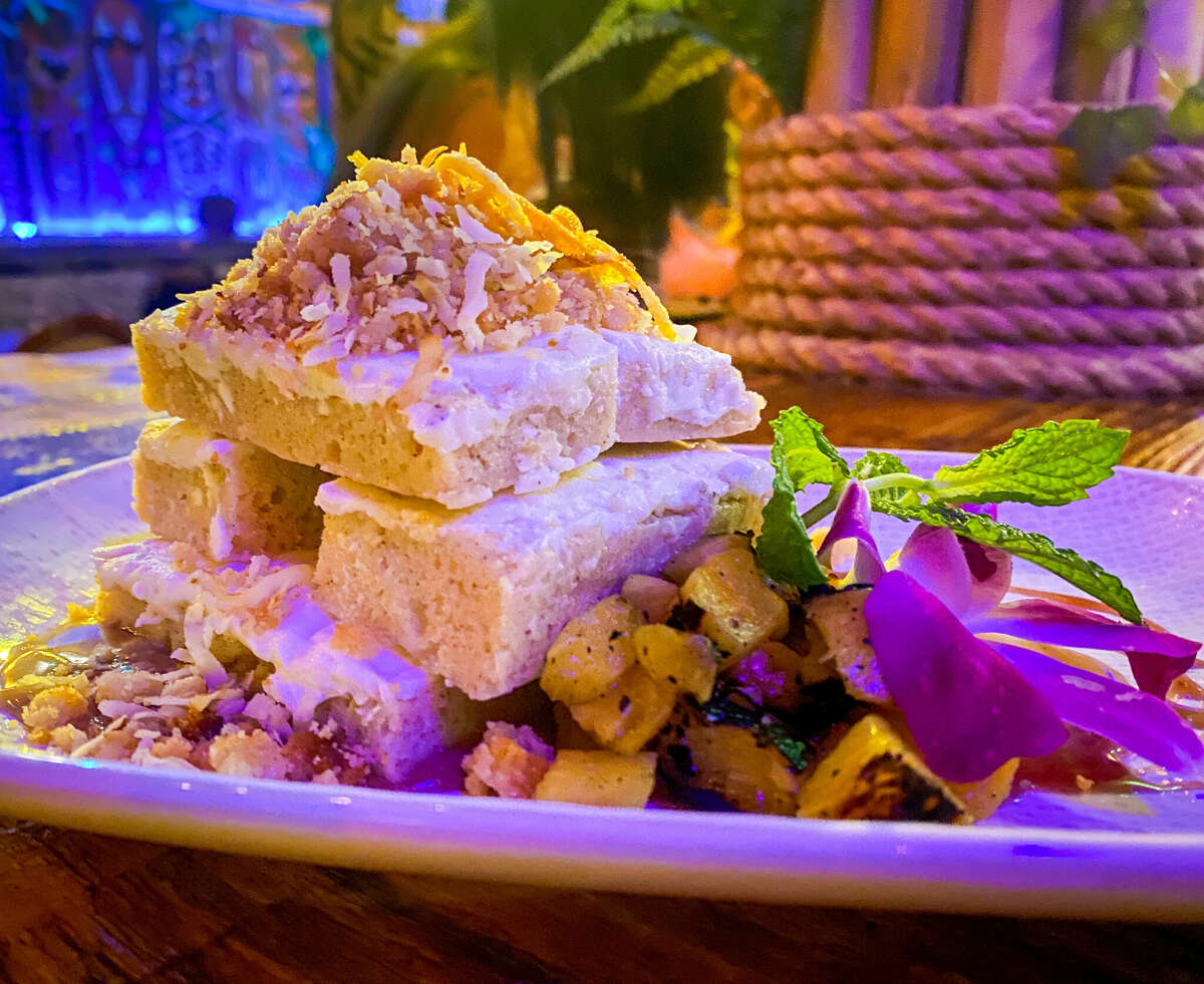 Pineapple Rum Cake ($12) at Hugman's Oasis is served as a mound of candy bars topped with pastry cream.