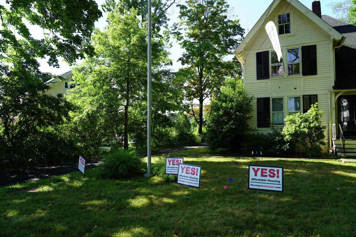 Developer Arnold Karp has place signs promoting affordable housing on his property on Main Street, where he expects to build a 20-unit 8-30g development. Picture was taken July 19, 2022.