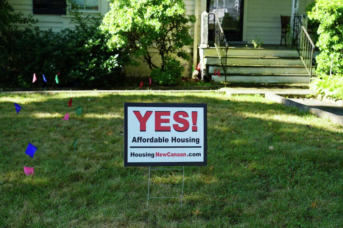 Developer Arnold Karp has placed signs promoting affordable housing on his property on Main Street, where he expects to make into a 20-unit 8-30g development. Picture was taken July 19, 2022.