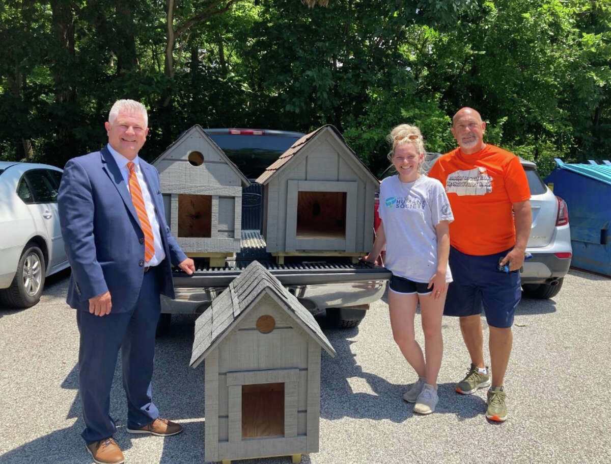 Pictured from left to right, Madison County Regional Superintendent of Schools, Rob Werden, Metro East Humane Society representative, Belle Hargraves, and Brad Bevis, Maintenance Coordinator for the Madison County ROE.