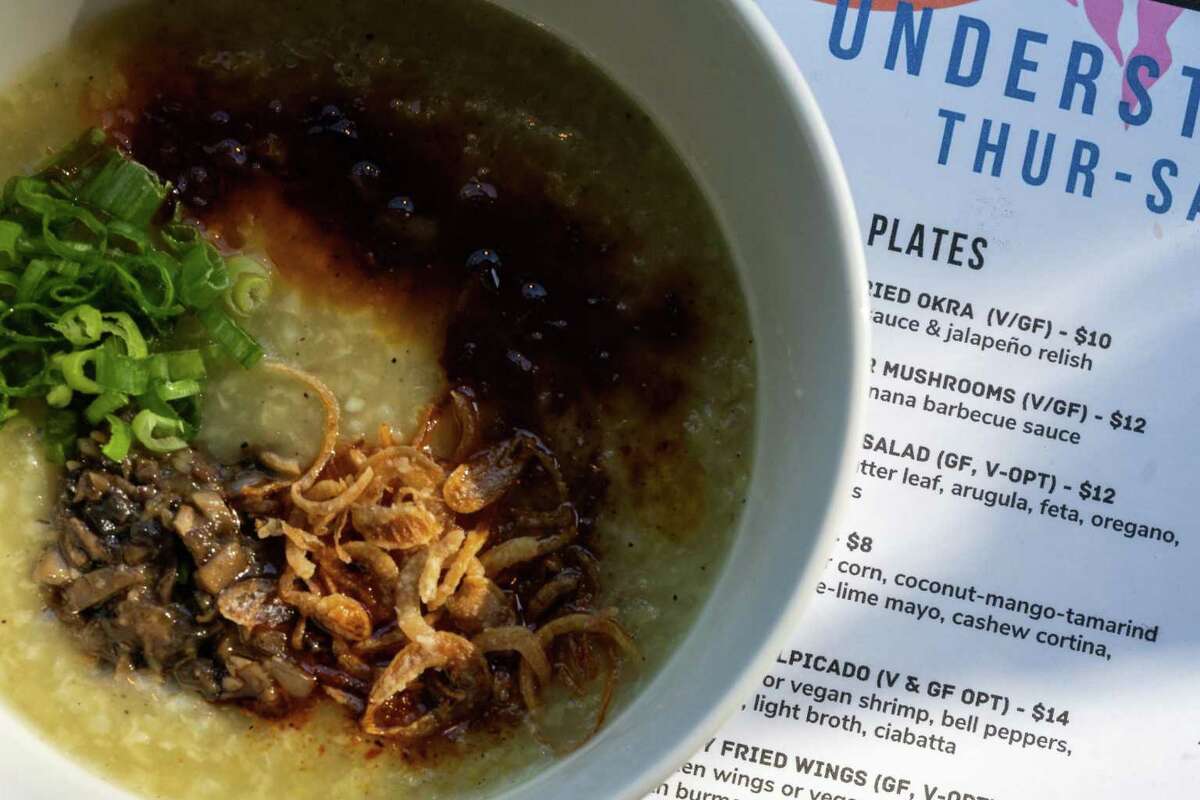 The seasonal dinner menu and a bowl of lugaw at Understory in Oakland, Calif. on Friday, July 15, 2022. Understory offers a rotating meal that is available on a sliding scale.