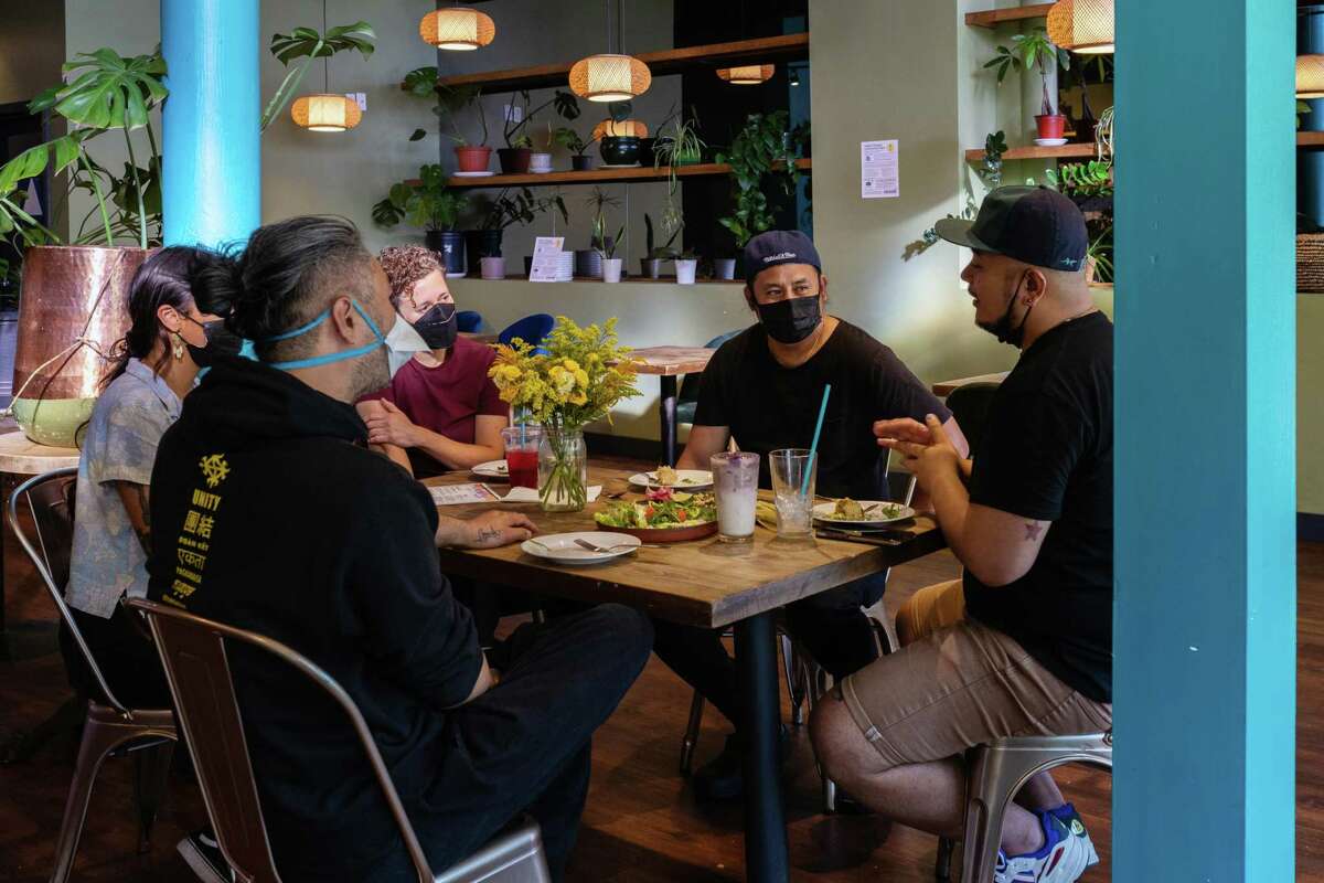 Oakland Bloom founder Sean Chow (front left) and Understory worker-leaders Von Champaayouroth (from left), Lily Fahsi-Haskell, Nino Serrano and Jenabi Pareja discuss new menu items.