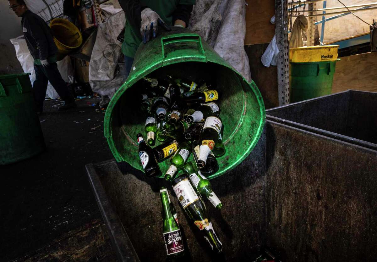 Colored glass bottles including wine and liquor bottles are shown at Our Planet Recycling center in San Francisco, Calif., on July 19, 2022.