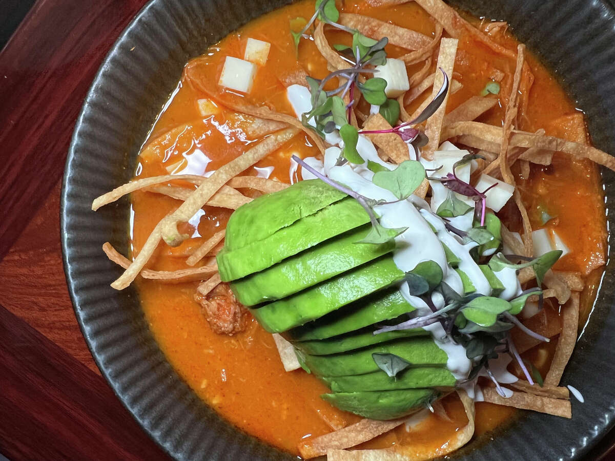 The tortilla soup includes chicken-chipotle broth, chicken, tortilla strips, queso panela and avocado at Panfila Cantina, a Mexican restaurant and bar on Bulverde Road near TPC Parkway in San Antonio.