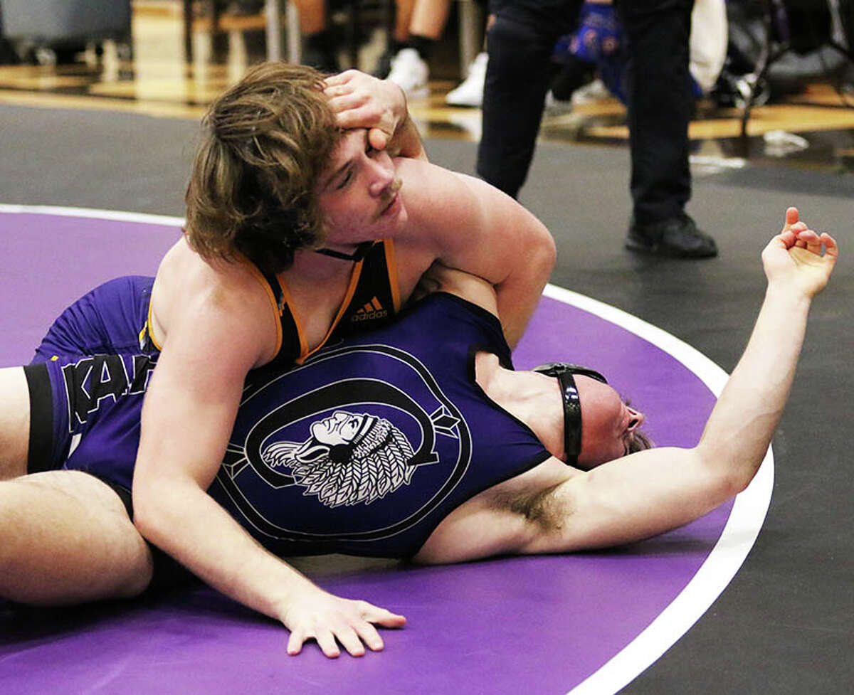 CM's Abe Wojcikiewicz (top) tries to put Collinsville's Austin Stewart on his back the 170-pound title bout last December at the Mascoutah Tournament. Wojcikiewicz won the tourney and is the 2022 Telegraph Wrestler of the Year.