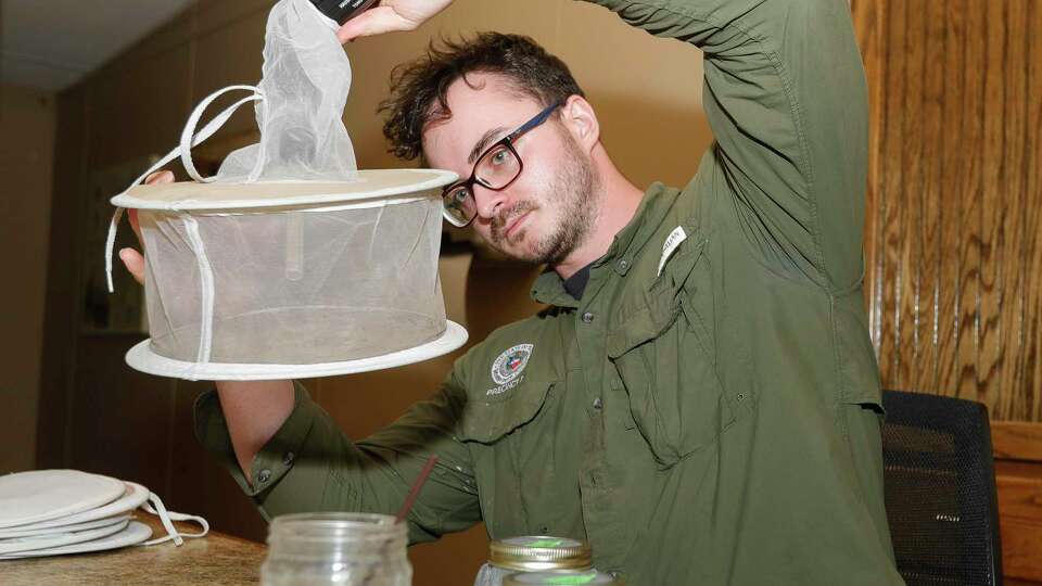 Jason Bean, with the Montgomery County Precinct 3 Mosquito Abatement team, gathers mosquitoes from traps around Precinct 3 in June. The Texas Department of State Health Services has confirmed the first human case of West Nile virus in Montgomery County for 2022.