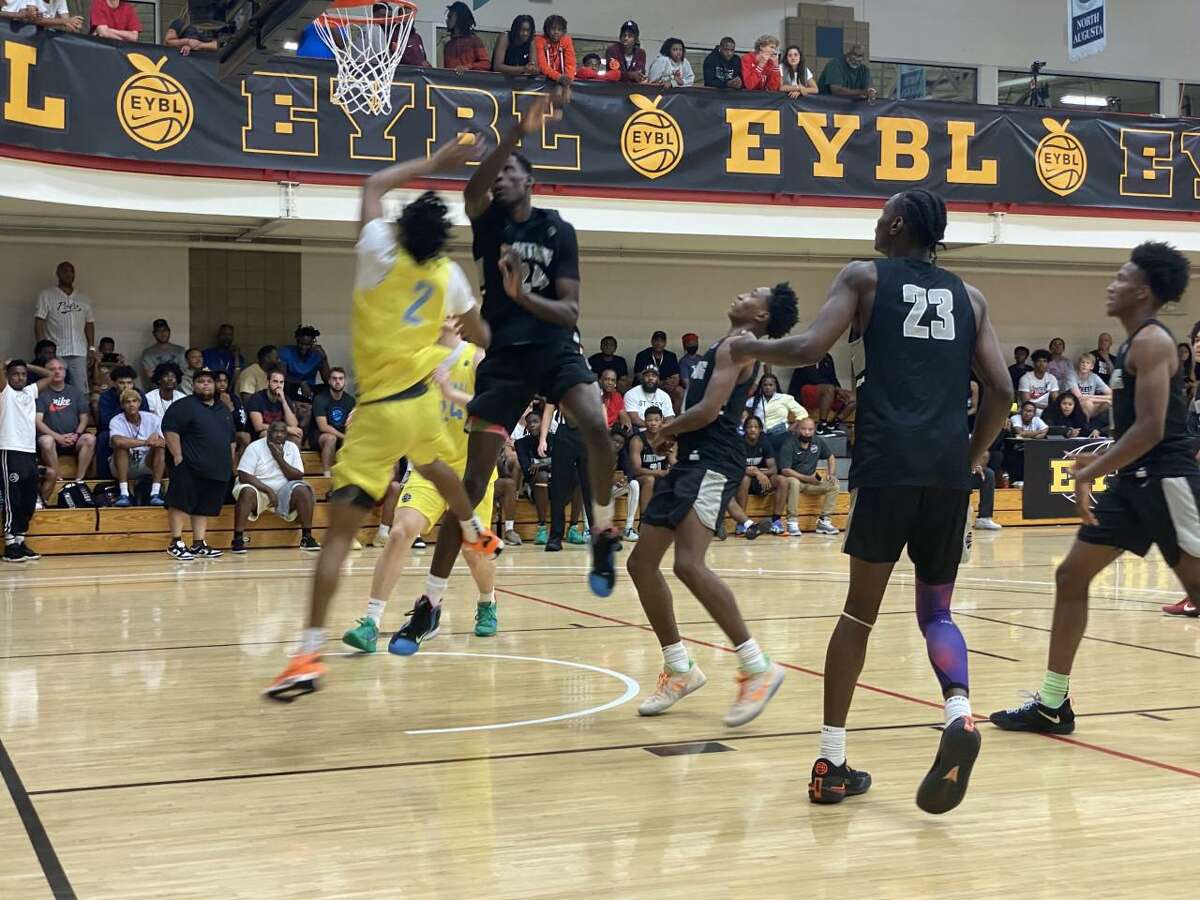 UConn recruiting target Youssouf Singare' (24) is a shot-blocking force for New Heights Lightning at the Peach Jam.