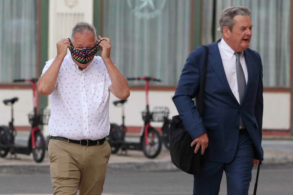 Former San Antonio attorney Christopher Pettit, left, walks with his attorney Michael G. Colvard into the Hipolito F. Garcia Federal Building to meet with creditors, Wednesday, July 20, 2022. Pettit is facing allegations that he stole tens of millions of dollars from his clients.