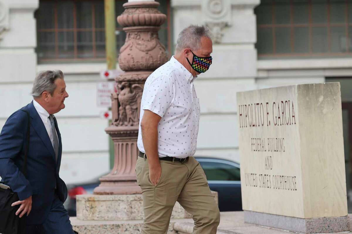 Former San Antonio attorney Christopher Pettit, right, walks with his attorney Michael G. Colvard into the Hipolito F. Garcia Federal Building to meet with creditors, Wednesday, July 20, 2022. Pettit is facing allegations that he stole tens of millions of dollars from his clients.