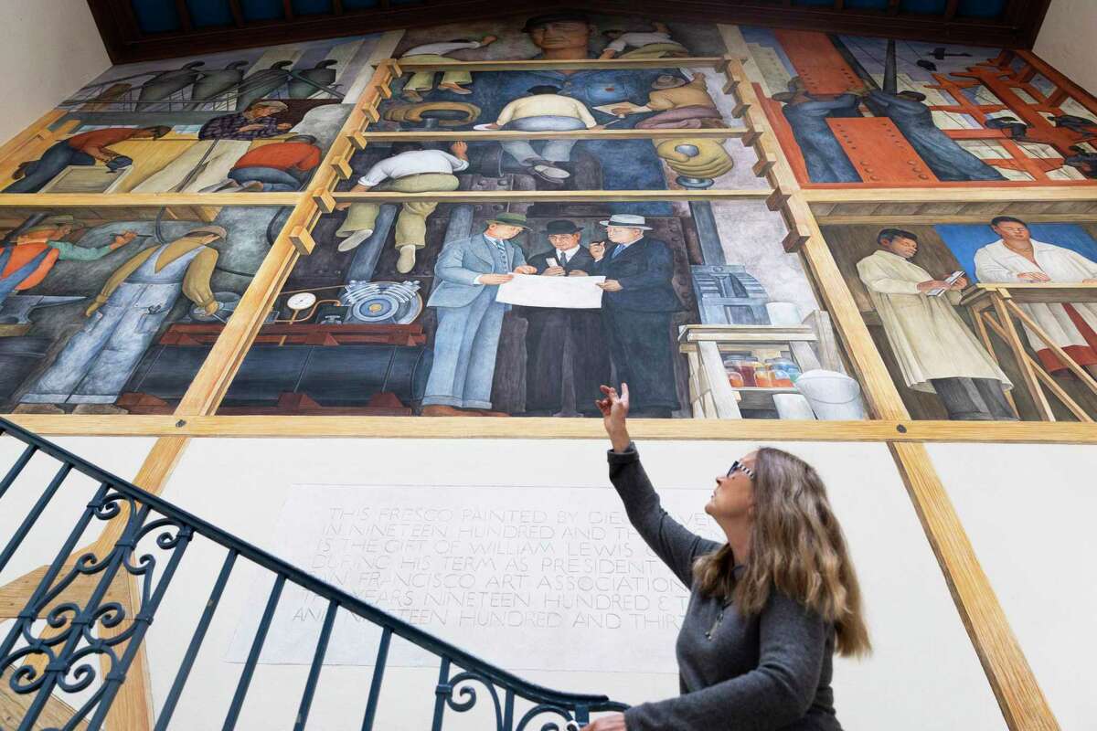 Zoya Kocur, project manager of the Diego Rivera Fresco Project, describes the restoration process of “The Making of a Fresco Showing the Building of a City,” painted by Diego Rivera in 1931, as it sits in a private San Francisco Art Institute gallery.