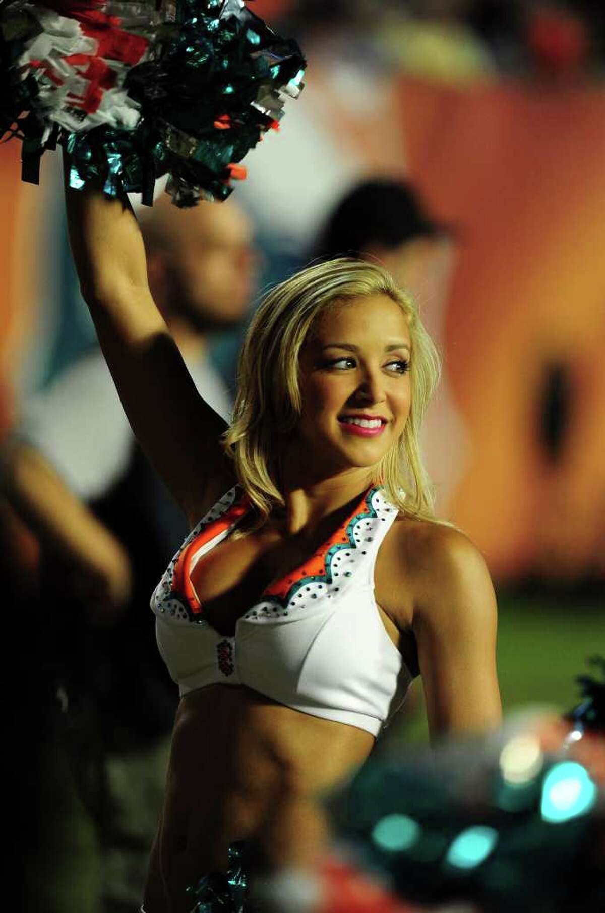 MIAMI - OCTOBER 4: A member of the Miami Dolphins Cheerleaders performs during the game against the New England Patriots at Sun Life Field on October 4, 2010 in Miami, Florida. (Photo by Scott Cunningham/Getty Images)