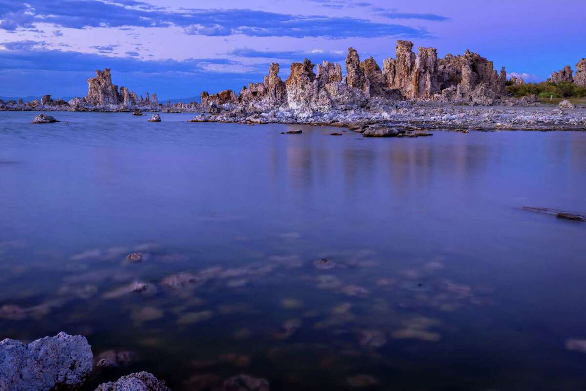 Tufa towers are visible above the water at Mono Lake outside Lee Vining (Mono County) in 2022. The water level at the lake has been receding significantly in recent years.