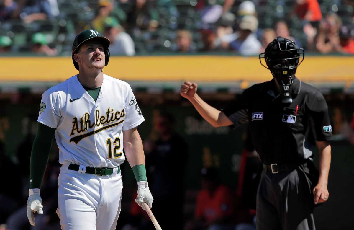 Sean Murphy (12) reacts after striking out swinging in the bottom of the ninth as the Oakland Athletics played the Houston Astros at the Coliseum in Oakland, Calif., on Sunday, July 10, 2022. The Astros defeated the A’s 6-1.
