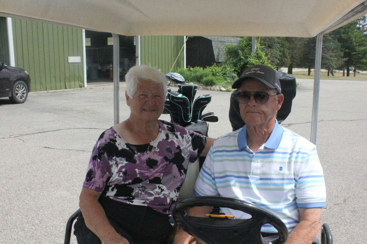 Kent and Nancy Lang get ready for a round of golf at Spring Valley Golf Course during Couples League action.