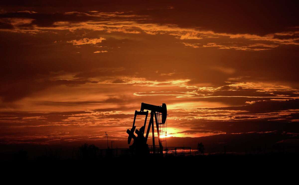 A pumpjack operates as the sun sets Tuesday, July 5, 2022, near Midland.