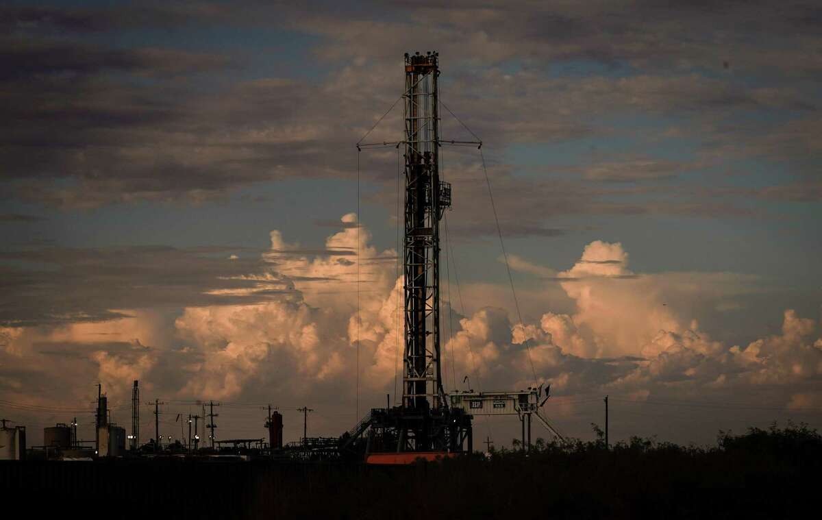 A drilling rig operates as the sun sets Wednesday, July 6, 2022, in Pecos, TX.